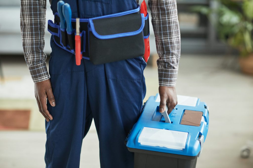 Worker Holding Toolbox